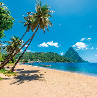 A view towards the Pitons in St Lucia from a beach in Soufriere